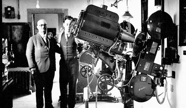 Gus Kerasotes in theater projection room (Sangamon Valley Collection)