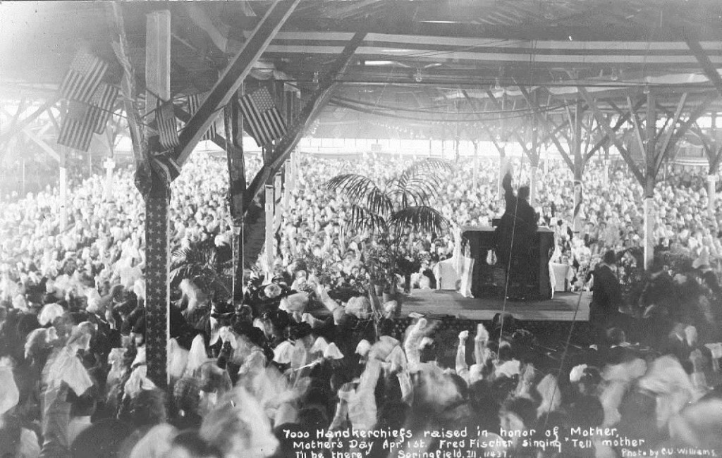 Billy Sunday's Springfield Tabernacle. Caption reads "7000 handkerchiefs raised in honor of Mother. Mother's Day Apr. 1st. Fred Fischer singing 'Tell Mother I'll be there' ... Photo by C.U. Williams"