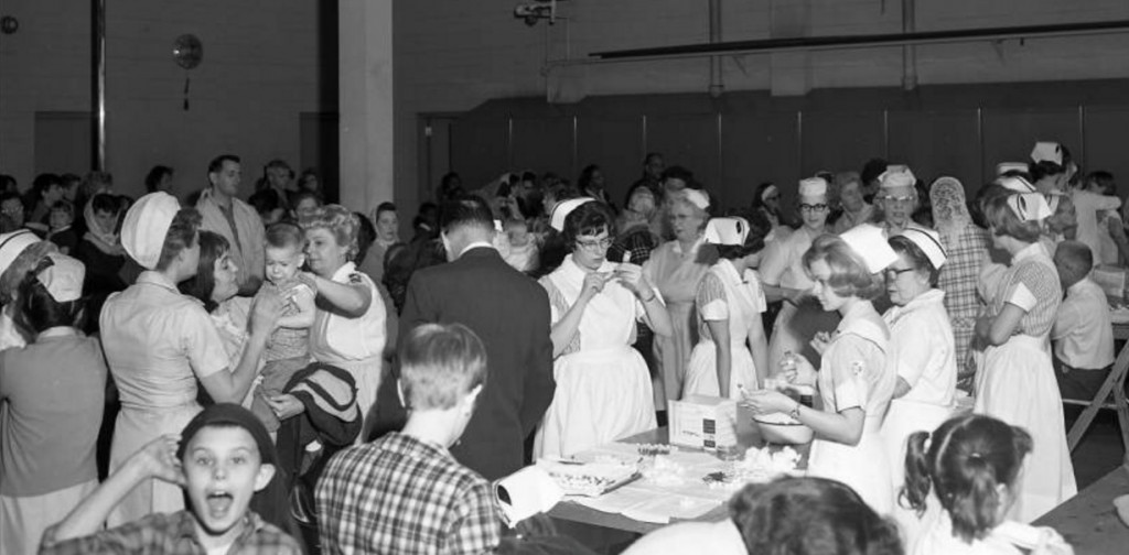 Children and their parents crowd the old Springfield Firehouse No. 1 for free measles vaccinations on March 18, 1966. (Mercury Studios collection, Illinois Digital Archives and Lincoln Library Sangamon Valley Collection)