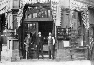 Richard N. Dodds, left, in hat, probably with two employees at door of store, undated (SVC)