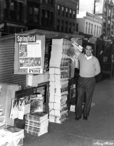 A news stand on Monroe Street east of Fifth Street, 1949 (Sangamon Valley Collection)