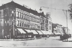 East side of the square, 1859. Section rebuilt after the 1888 fire is to the right (SVC)