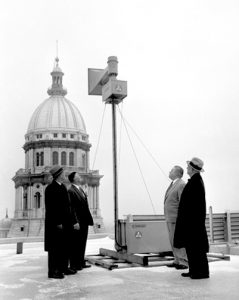 Officials view an installed emergency siren at the Statehouse, 1957 (Courtesy SJ-R)