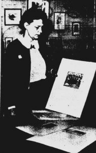 Virginia Stuart Brown in 1941, displaying an etching she had made of the Vachel Lindsay Home (courtesy State Journal-Register)