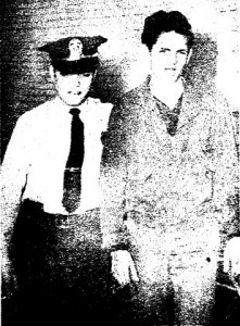 Frank Ewing Jr. following his arrest in the Pawnee High fire. Escorting him is Sangamon County Deputy Sheriff Kenneth Revell. (SJ-R)