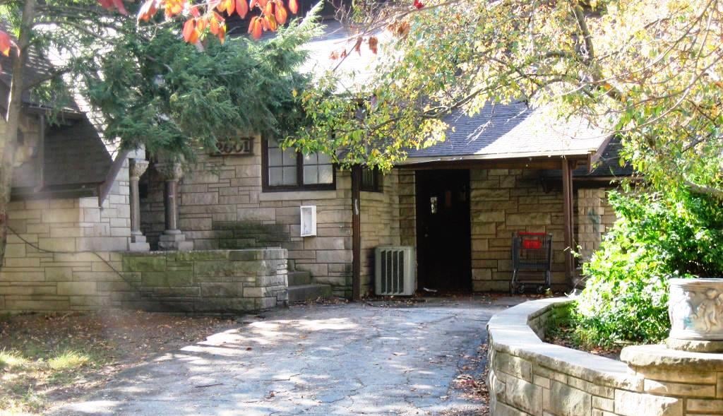 Front door of 2601 S. Glenwood Ave. in 2015. The pillars on either side of the porch are "hand carved granite columns taken from and old Springfield building," according to a 1954 article. (SCHS photo)