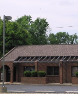 Elmer Kneale flagpole, above trees on North Rutledge Street, viewed from North Grand Avenue (SCHS)
