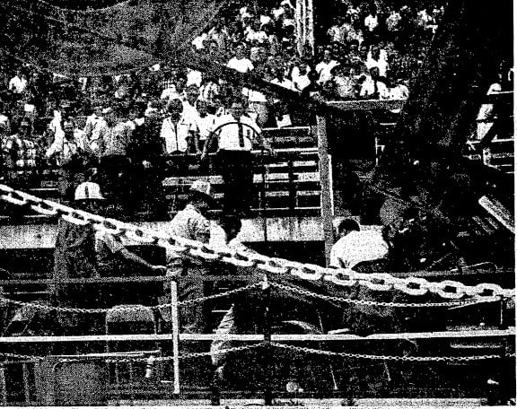 Sangamon County Rescue Squad members remove a body from the wreckage of the Illinois State Fair grandstand, Aug. 20, 1966 (SJR)