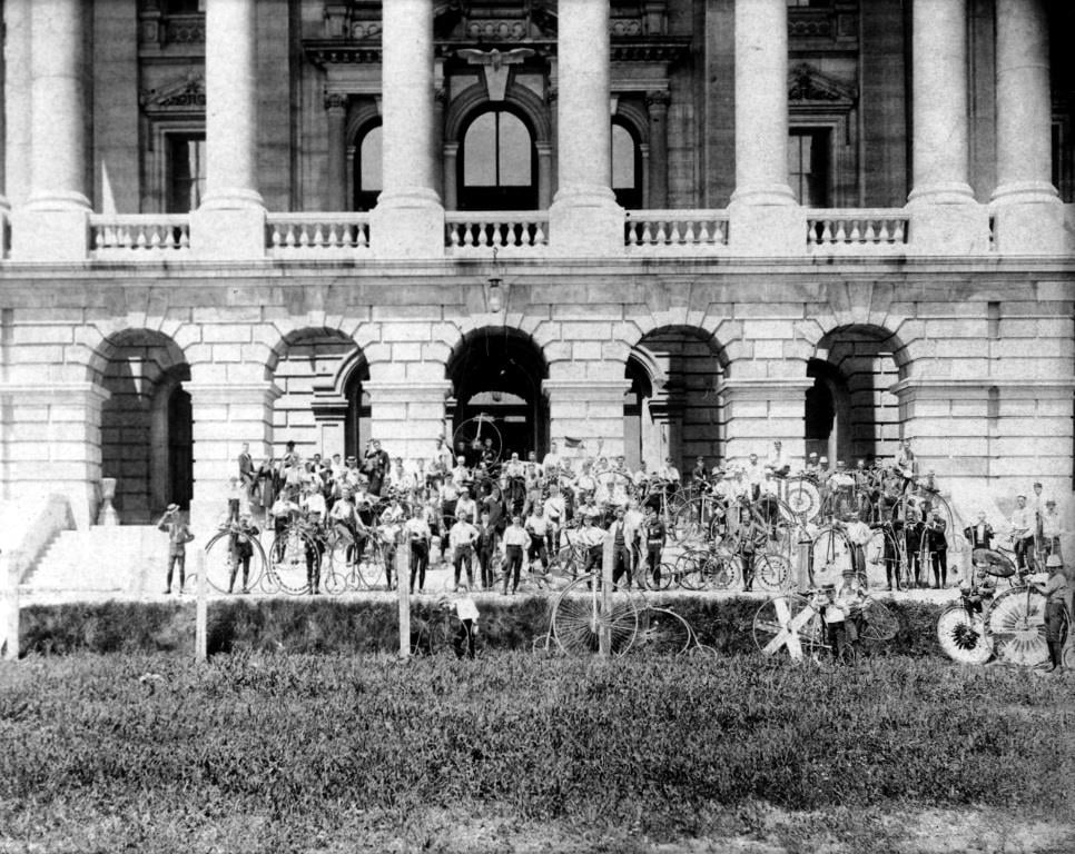 A group of riders at the Statehouse during the 1891 state League of American Wheelmen meet. Note the high-wheel bicycles. (Sangamon Valley Collection)