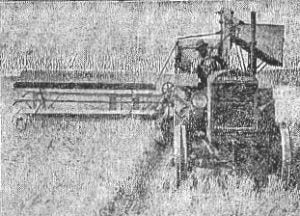 McCormick-Deering tractor-propelled combine in action, 1927