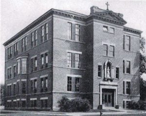 St. Joseph School with three floors and Patrick Henry in the entrance niche (Diamond Jubilee History)