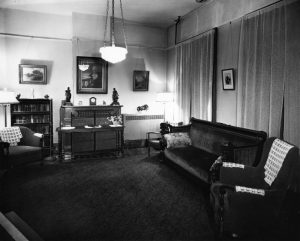 Carrie Post's image hangs above an unused fireplace in the dining room of the home in this undated photo (courtesy King's Daughters Organizatioin)